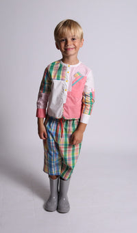 boy wearing plaid capri pants, rainbow, front