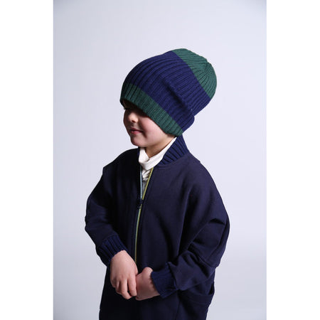 boy wearing blue and green knit beanie