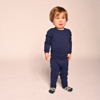 baby boy wearing knit blue cotton basic leggings