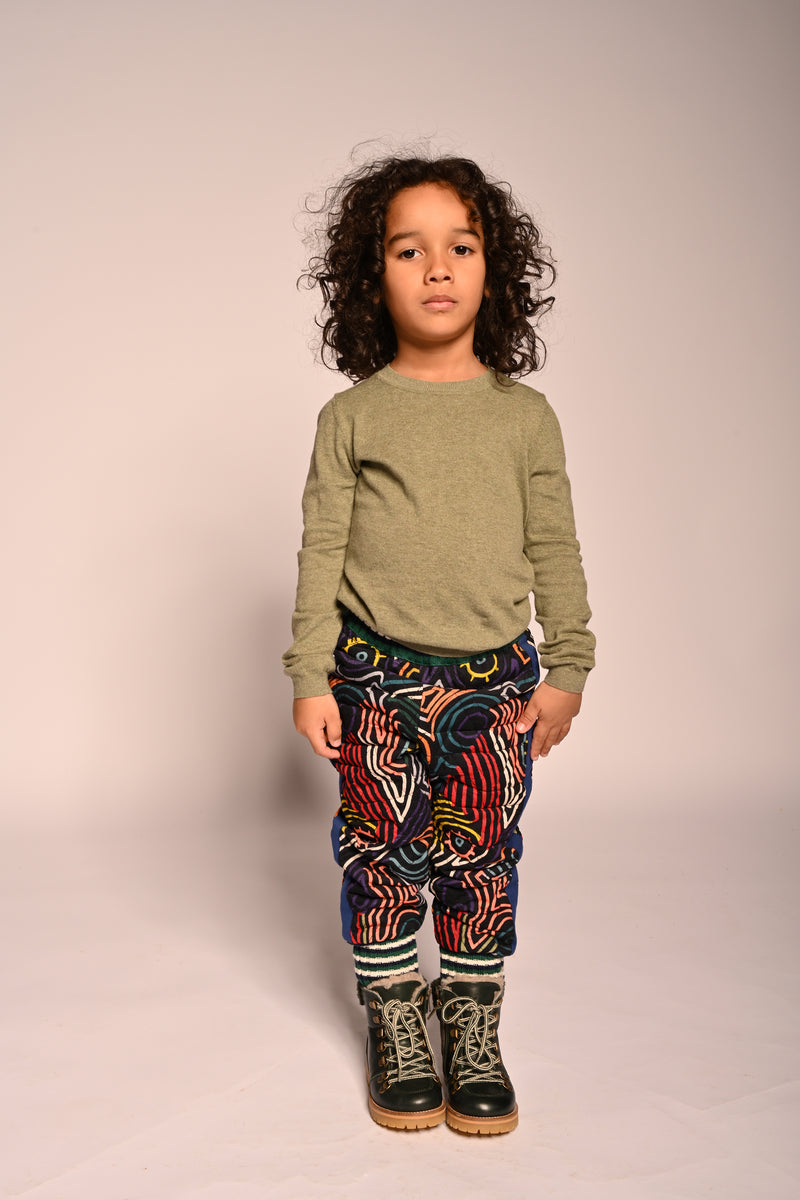 boy wearing padded cotton corduroy jogger track pants with all over print