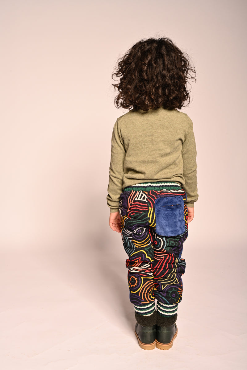 boy wearing padded cotton corduroy jogger track pants with all over print
