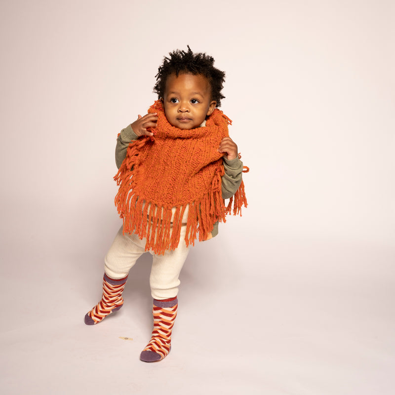 baby girl orange hand knit wool slip over shrug with tassels