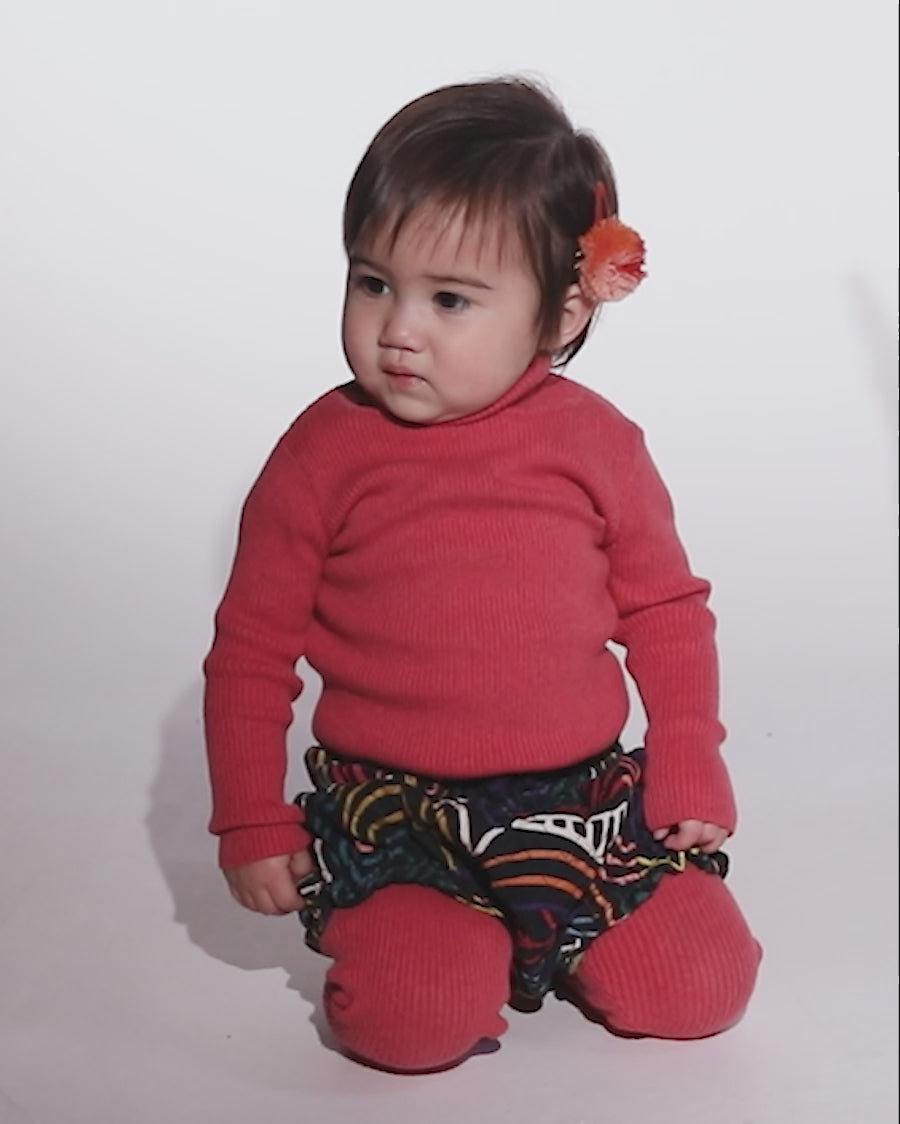 video of baby girl wearing red knit cotton ribbed turtleneck