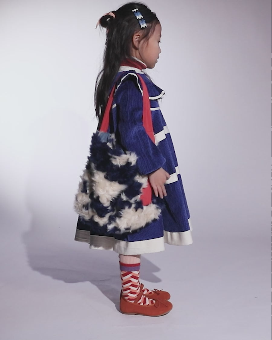 video of girl wearing blue cotton corduroy dress with sleeves and white stripes