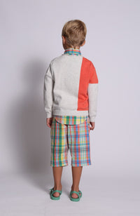 boy wearing unisex pullover sweater, knit, red, pink, white, stripe, back