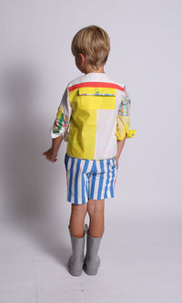 boy wearing yellow henley top, plaid patchwork, back