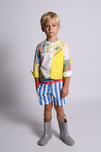 boy wearing yellow henley top, plaid patchwork